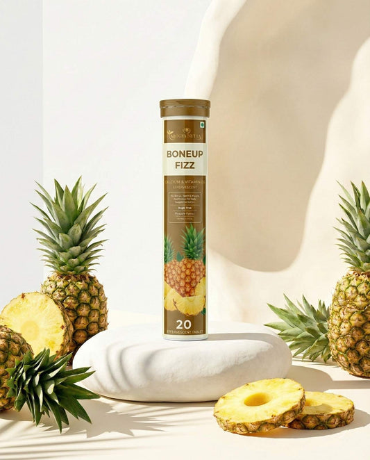 Tube of Boneup Fizz with pineapples on a light background
