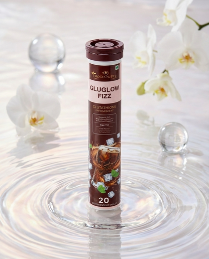 Glutathione supplement tube labeled 'Gluglow Fizz' on a water surface with flowers in the background