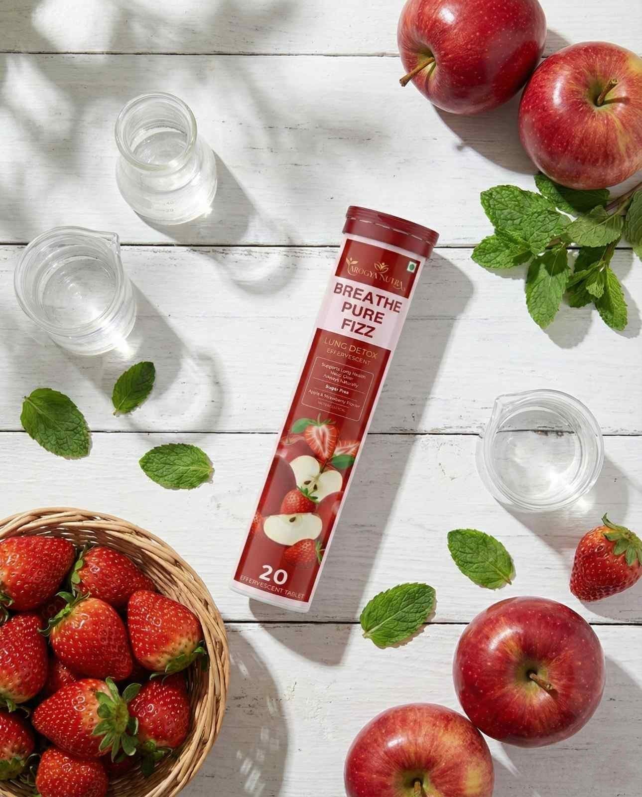 Breathe Pure Dizz supplement package with apples, strawberries, and water on a wooden surface